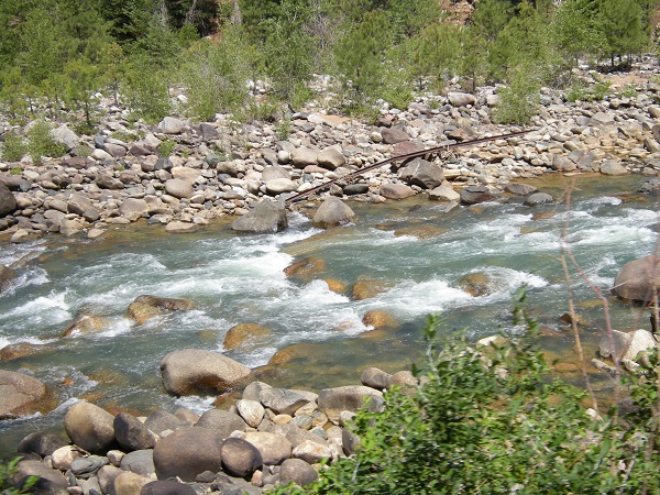 Bent rail pushed into the river by an avalanche